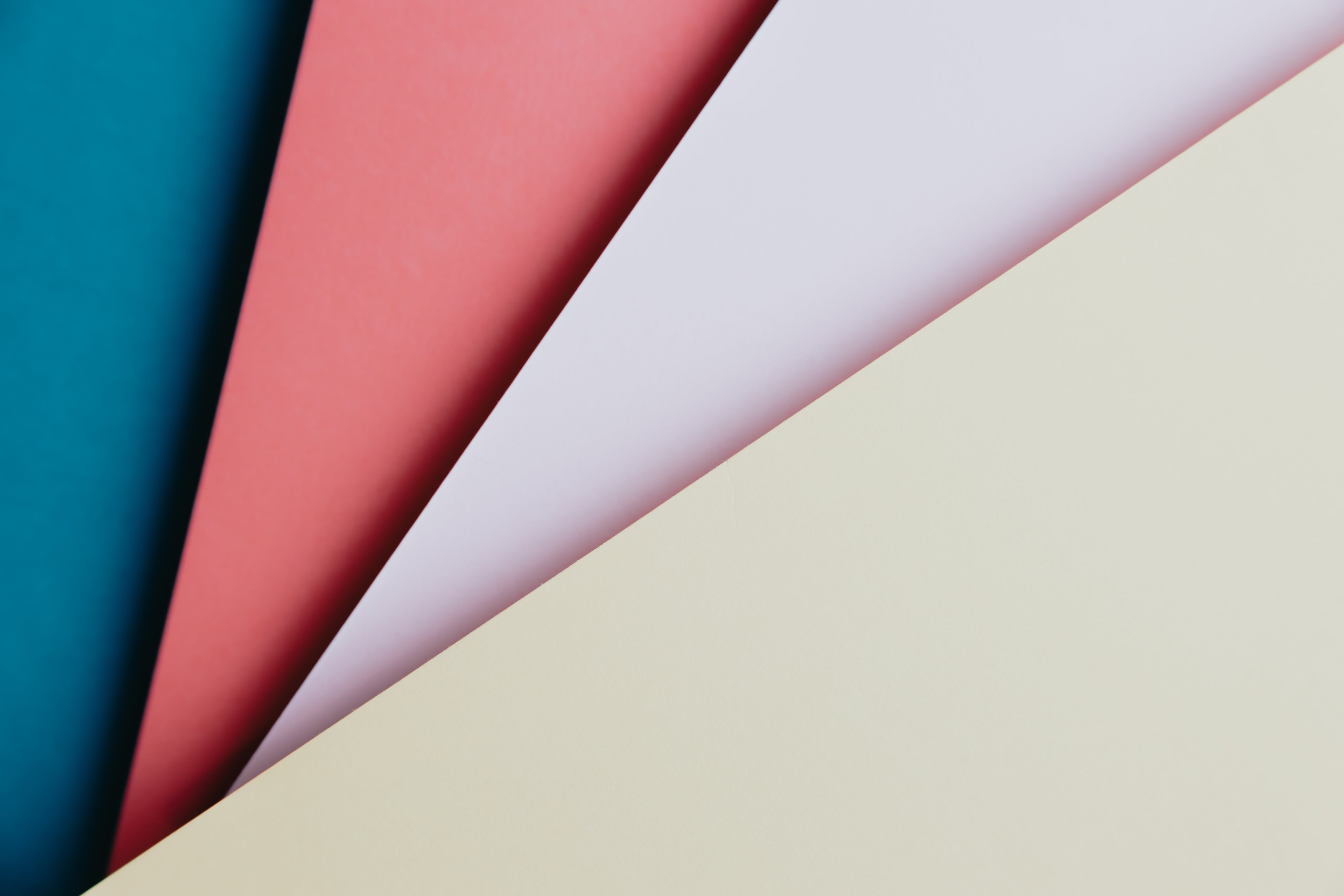 blue-red-pink-and-yellow-paper-fanned-out